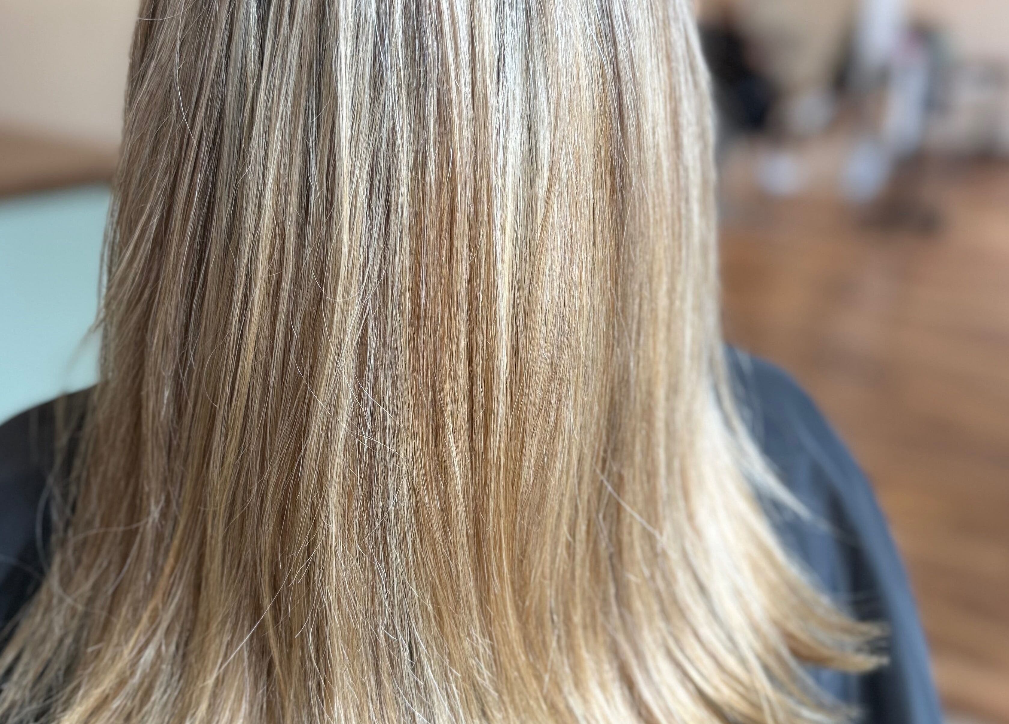 Silky smooth blonde hair at Hair To A T By Tee in Arnoldsville, Georgia, US.