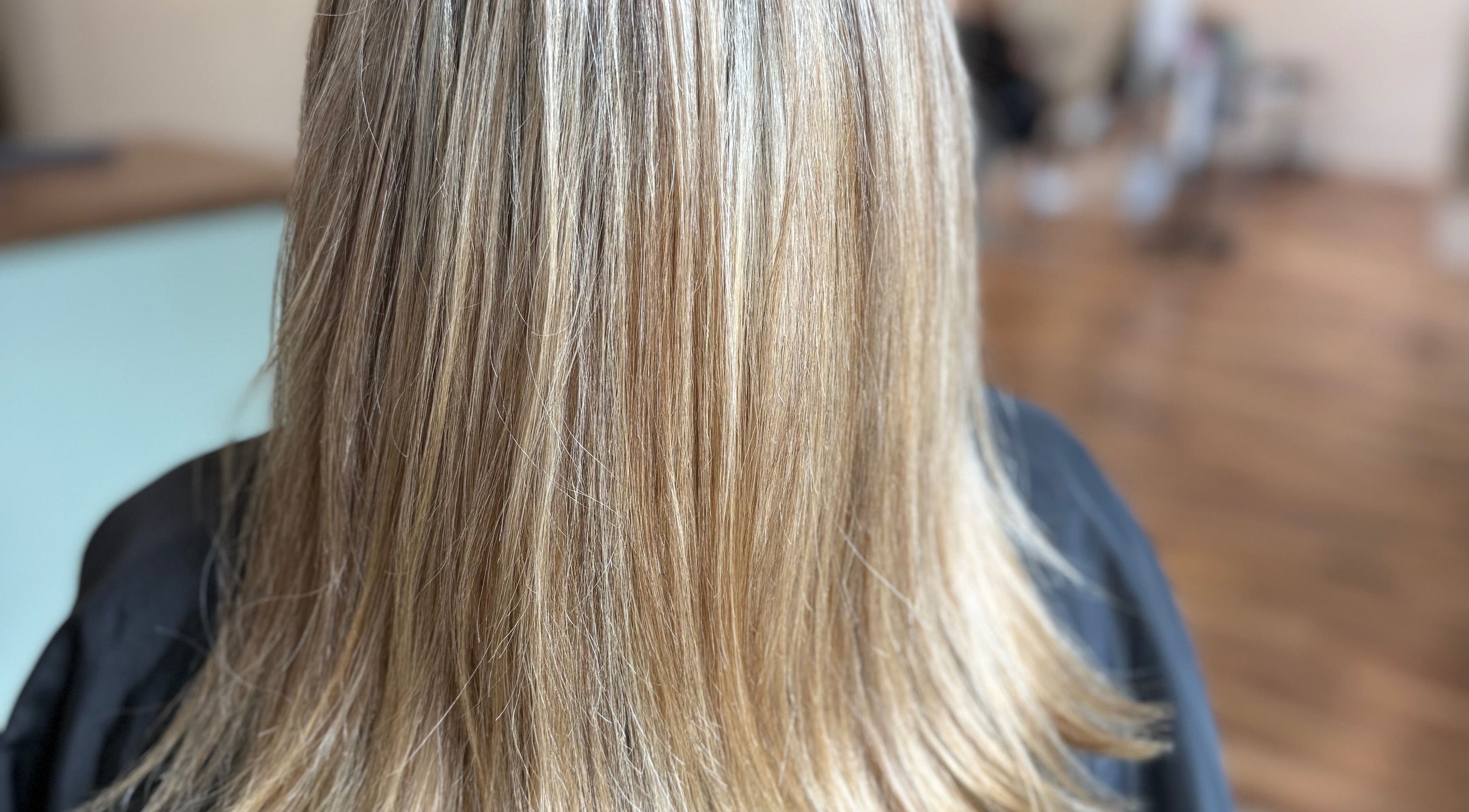 Silky smooth blonde hair at Hair To A T By Tee in Arnoldsville, Georgia, US.