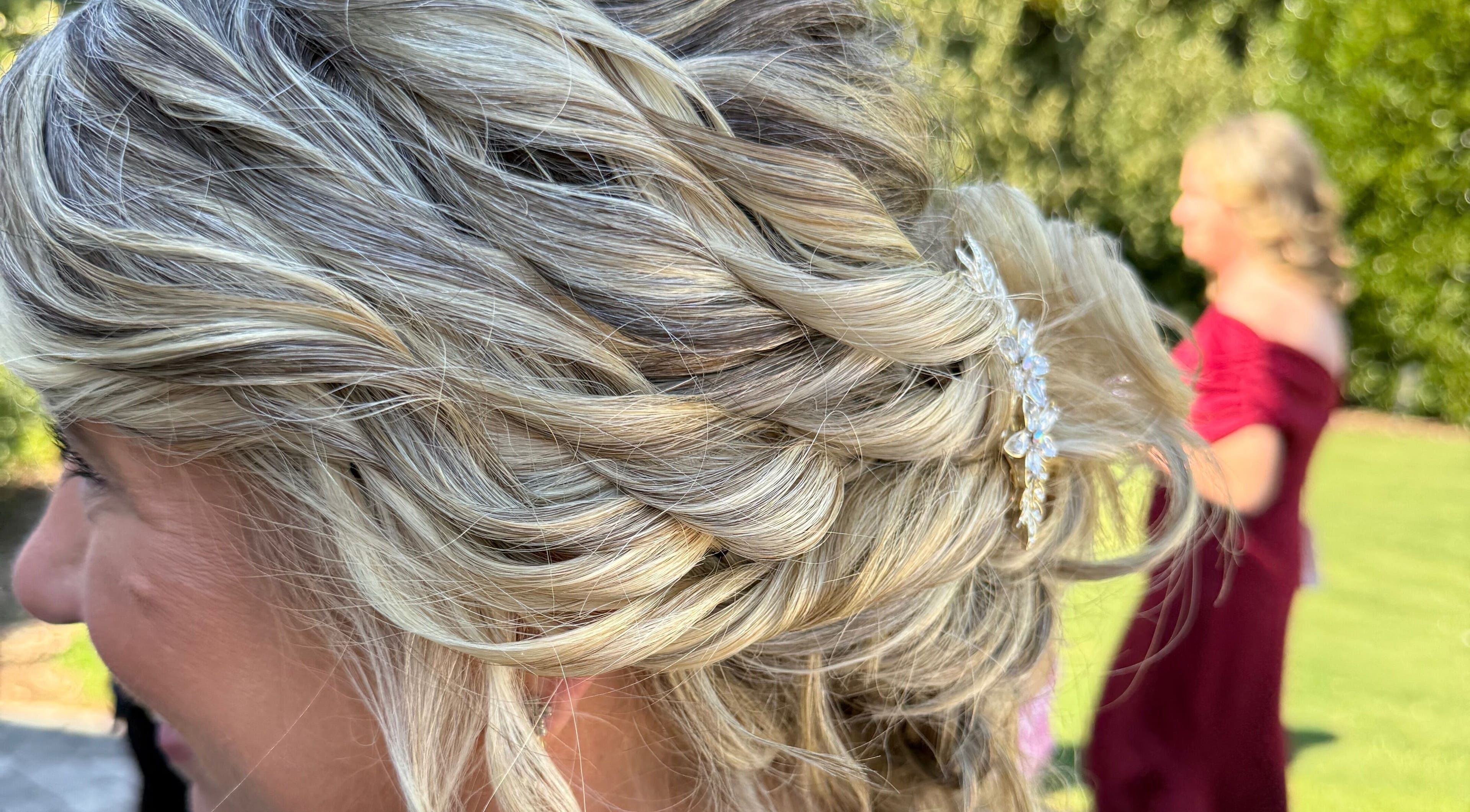 Beautiful updo hairstyle with blonde highlights at Hair To A T By Tee, Arnoldsville, Georgia, US.