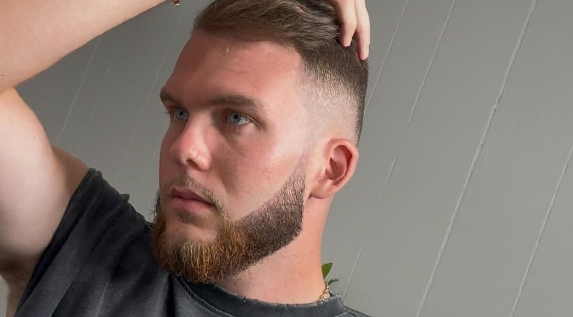 Man with stylish haircut at Sacred Diamond Lifestyle Club, Nashville, Tennessee, US.