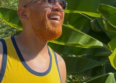 A smiling individual enjoying nature at Sacred Diamond Lifestyle Club, Nashville, Tennessee, US.
