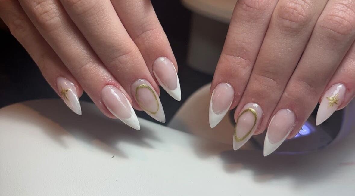 Stylish nail art at A.lnails, Londonderry, Northern Ireland, GB featuring pointed tips with subtle gold accents.