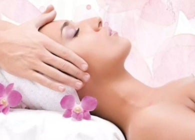 Relaxing massage at Mary Vanity, East Kilbride, Scotland, GB, with pink orchids and calming ambiance.