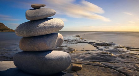 Serene stone stack at sunset near Think2be Healthy, North Lakes, Queensland, AU.