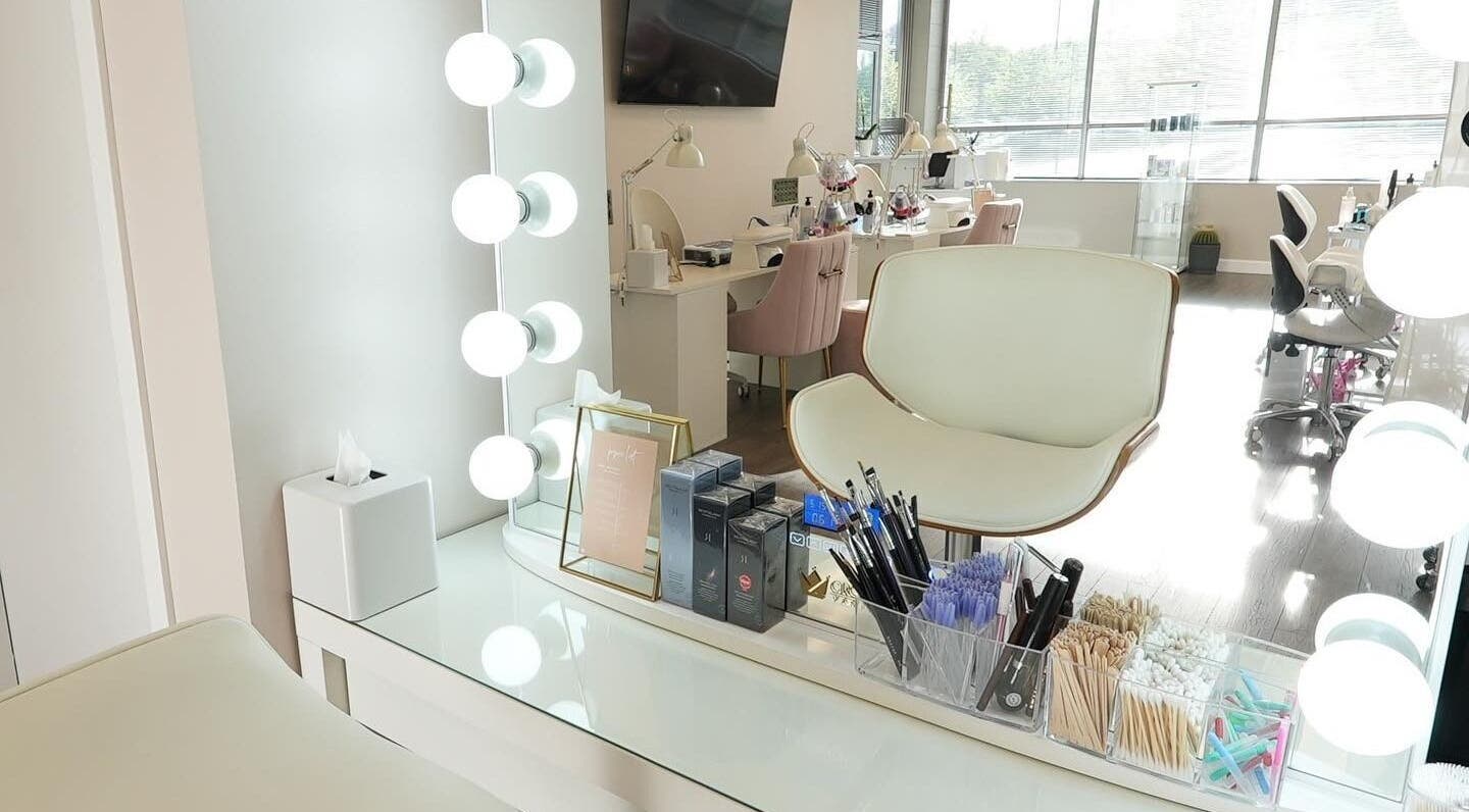 Elegant makeup station at Kvadrat Room, Des Plaines, Illinois, US, with bright lights and beauty tools.