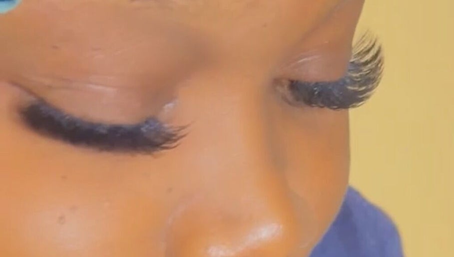 Close-up of expertly applied eyelash extensions at Facial Expressions Artistry, Nassau, New Providence, BS.
