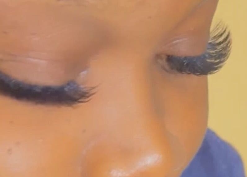 Close-up of expertly applied eyelash extensions at Facial Expressions Artistry, Nassau, New Providence, BS.