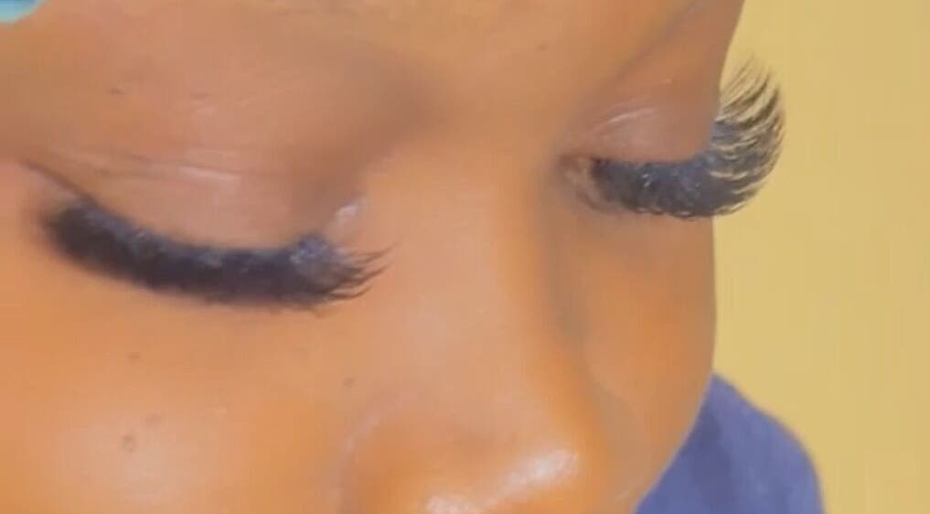 Close-up of expertly applied eyelash extensions at Facial Expressions Artistry, Nassau, New Providence, BS.