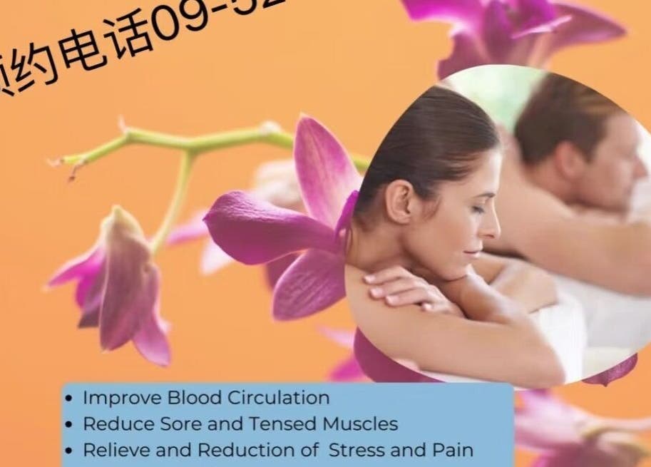 A couple enjoying massage therapy at Aah Spa Massage, Auckland, NZ surrounded by vibrant orchids.