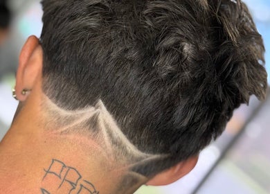 Close-up of a trendy haircut at Ritual - Classic Barbershop, Logan, Utah, US with artistic neckline design.