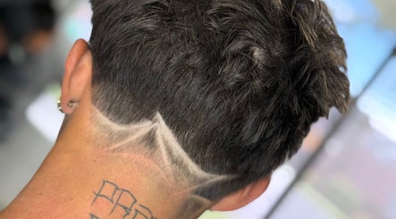 Close-up of a trendy haircut at Ritual - Classic Barbershop, Logan, Utah, US with artistic neckline design.