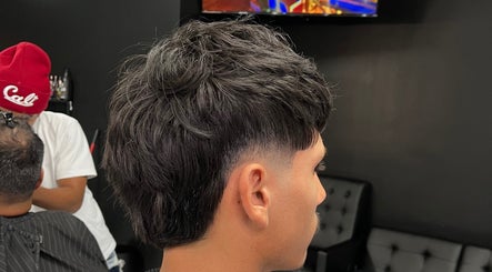 Man receiving a stylish haircut at Ritual - Classic Barbershop, Logan, Utah, US.