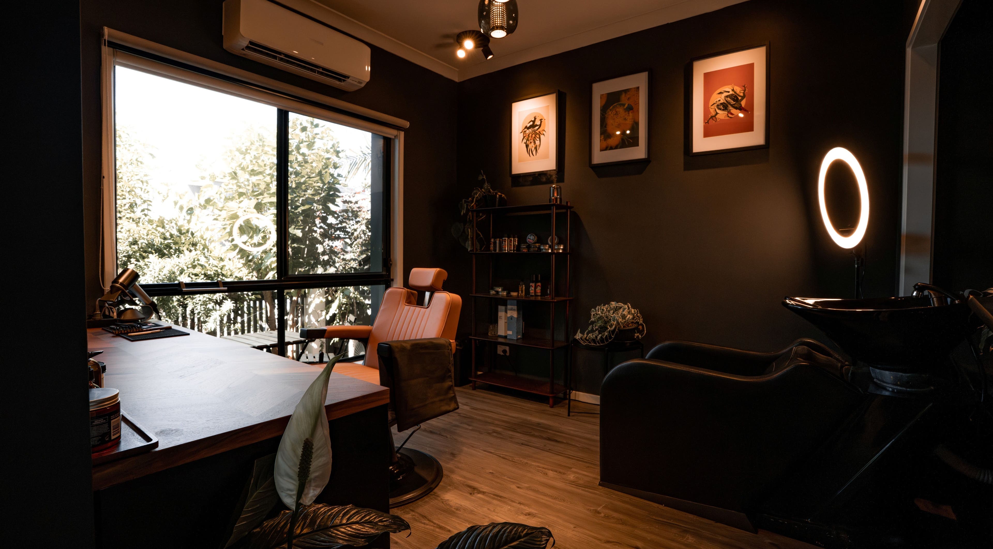 Stylish interior of Caleb Sweeney Barber in Nirimba, Queensland, AU, featuring a chic barber chair and modern decor.