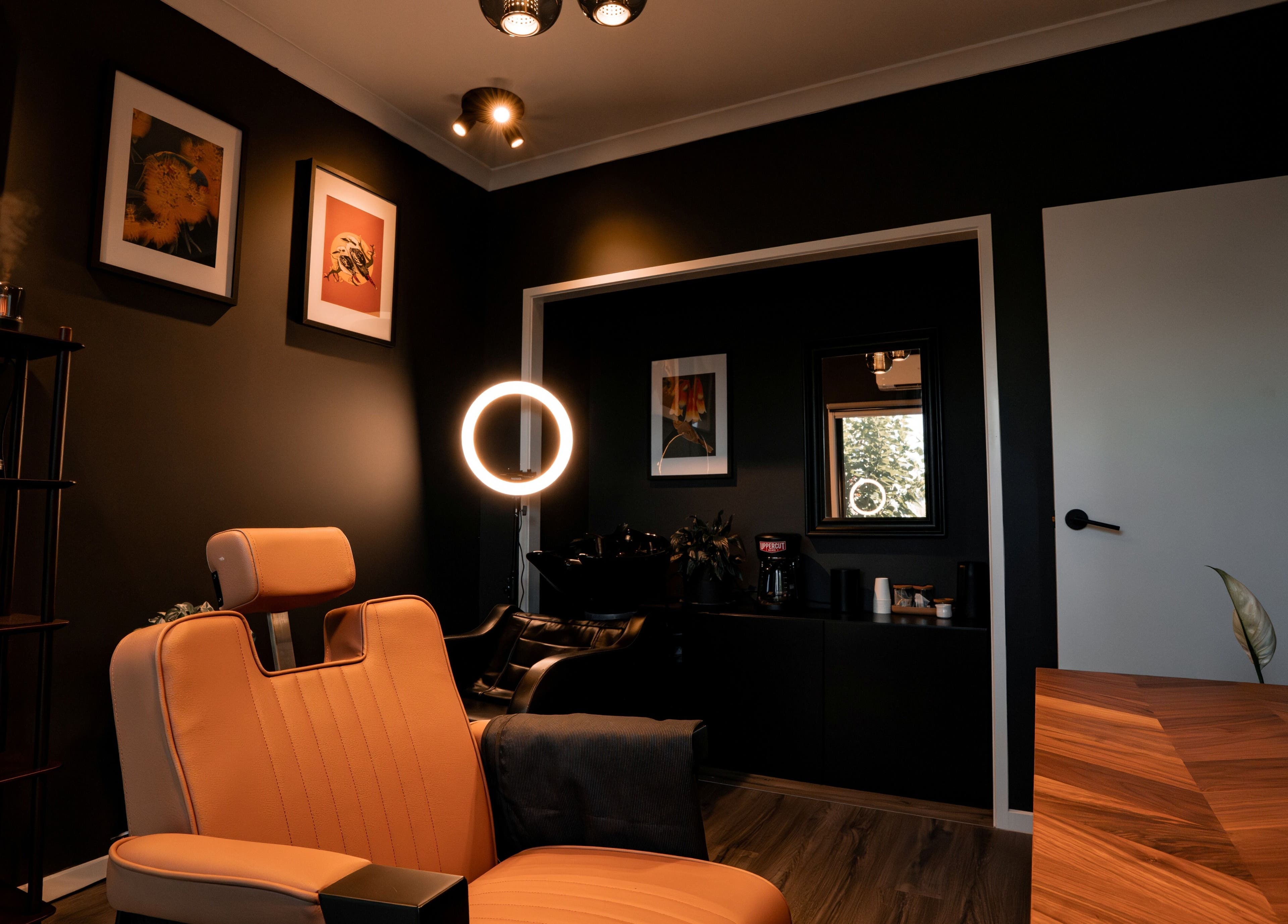 Relaxing interior of Caleb Sweeney Barber, Nirimba, Queensland, AU with stylish decor and comfortable chair.