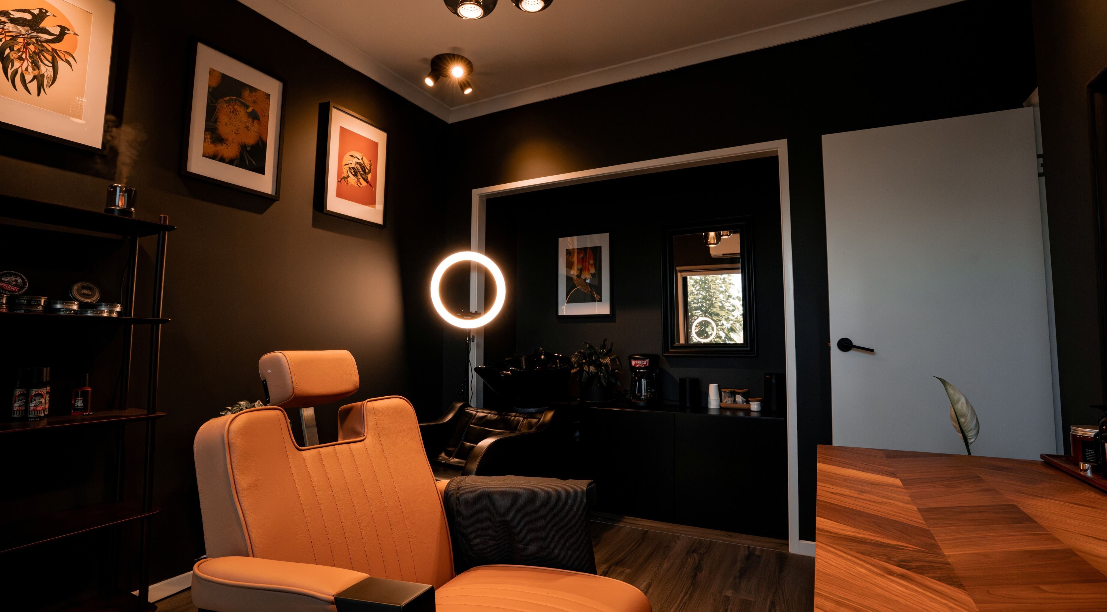 Relaxing interior of Caleb Sweeney Barber, Nirimba, Queensland, AU with stylish decor and comfortable chair.