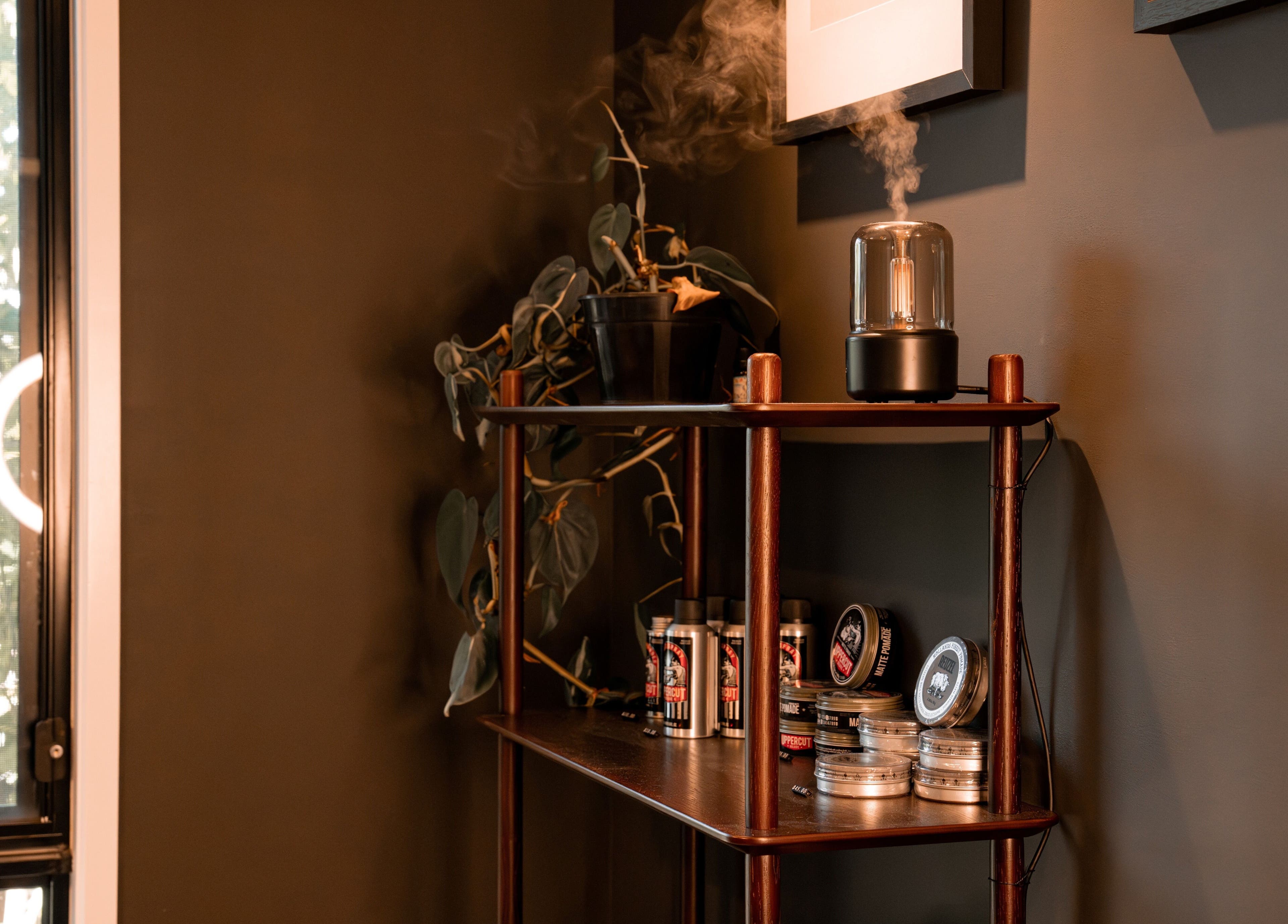 Cozy shelf setup at Caleb Sweeney Barber in Nirimba, Queensland, AU, featuring grooming products.
