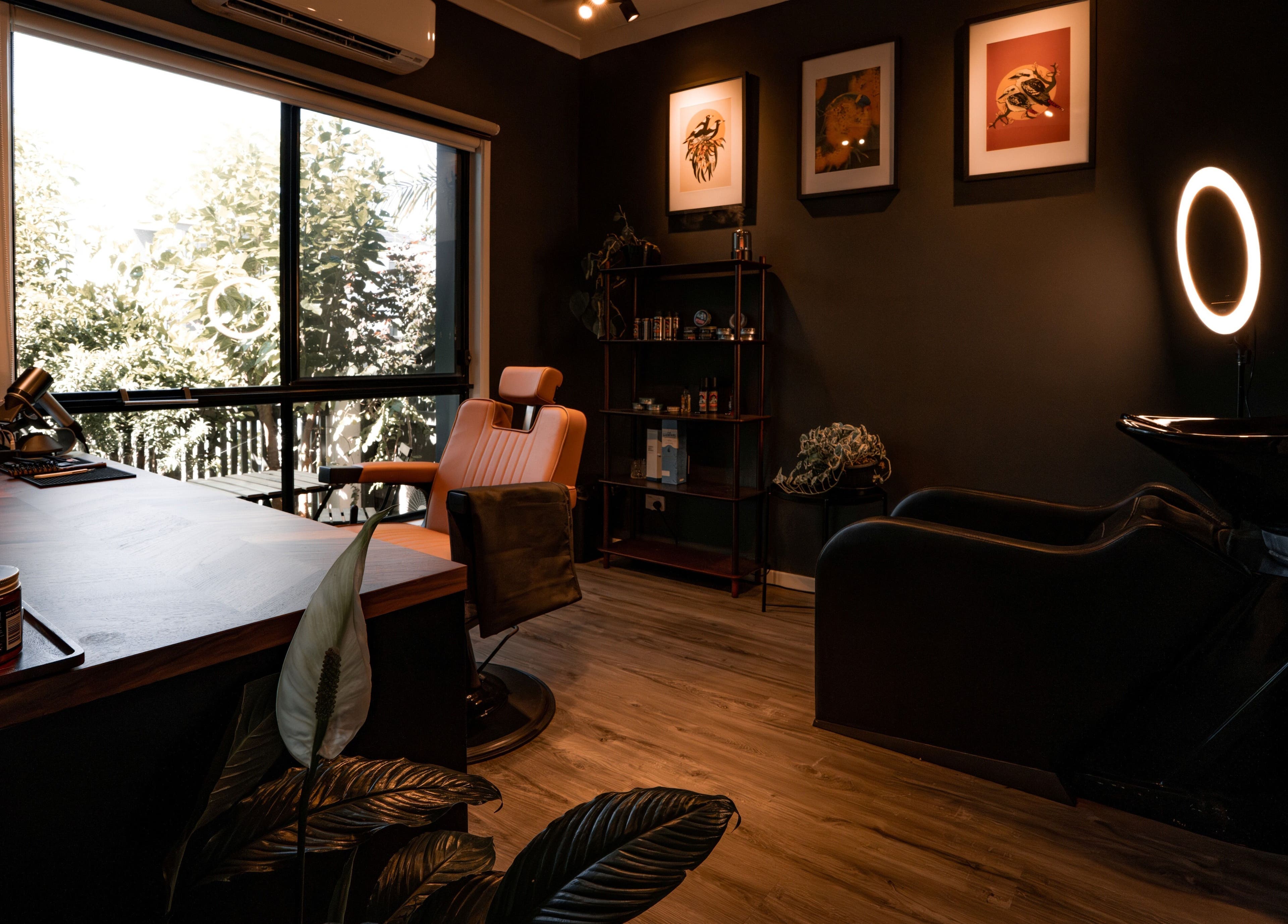 Inside Caleb Sweeney Barber's trendy space in Nirimba, Queensland, AU featuring a chic setup and modern decor.