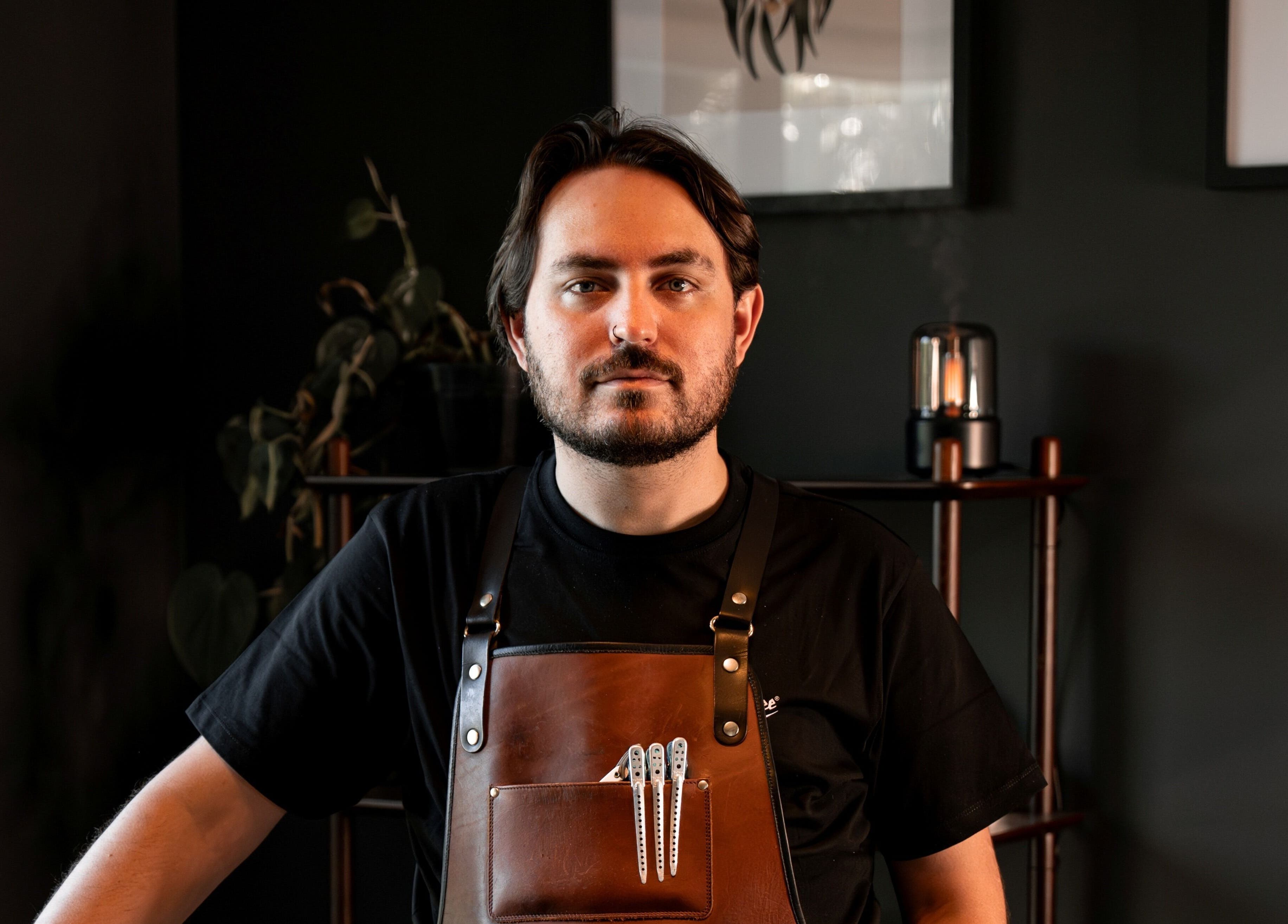 Professional barber at Caleb Sweeney Barber, Nirimba, Queensland, AU, showcasing elegant craftsmanship.