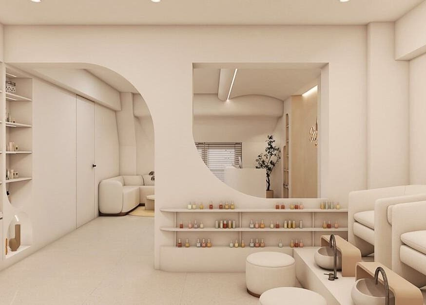 Elegant interior of Moonie Nails, Woolooware, New South Wales, AU showcasing modern seating and nail polish display.