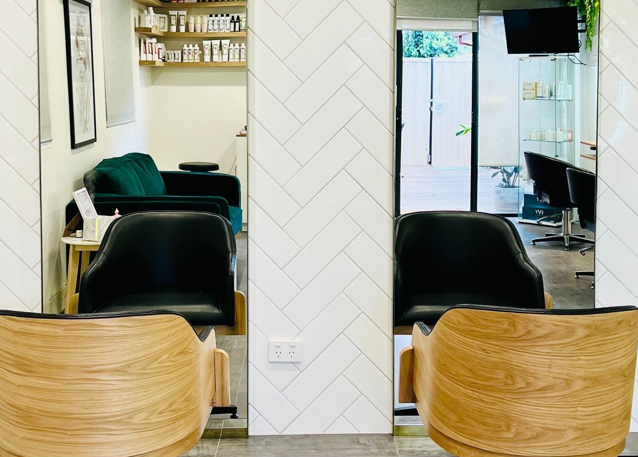 Modern salon chairs and decor at Hairjaz Studio, Melbourne, Victoria, AU showcasing elegance and style.