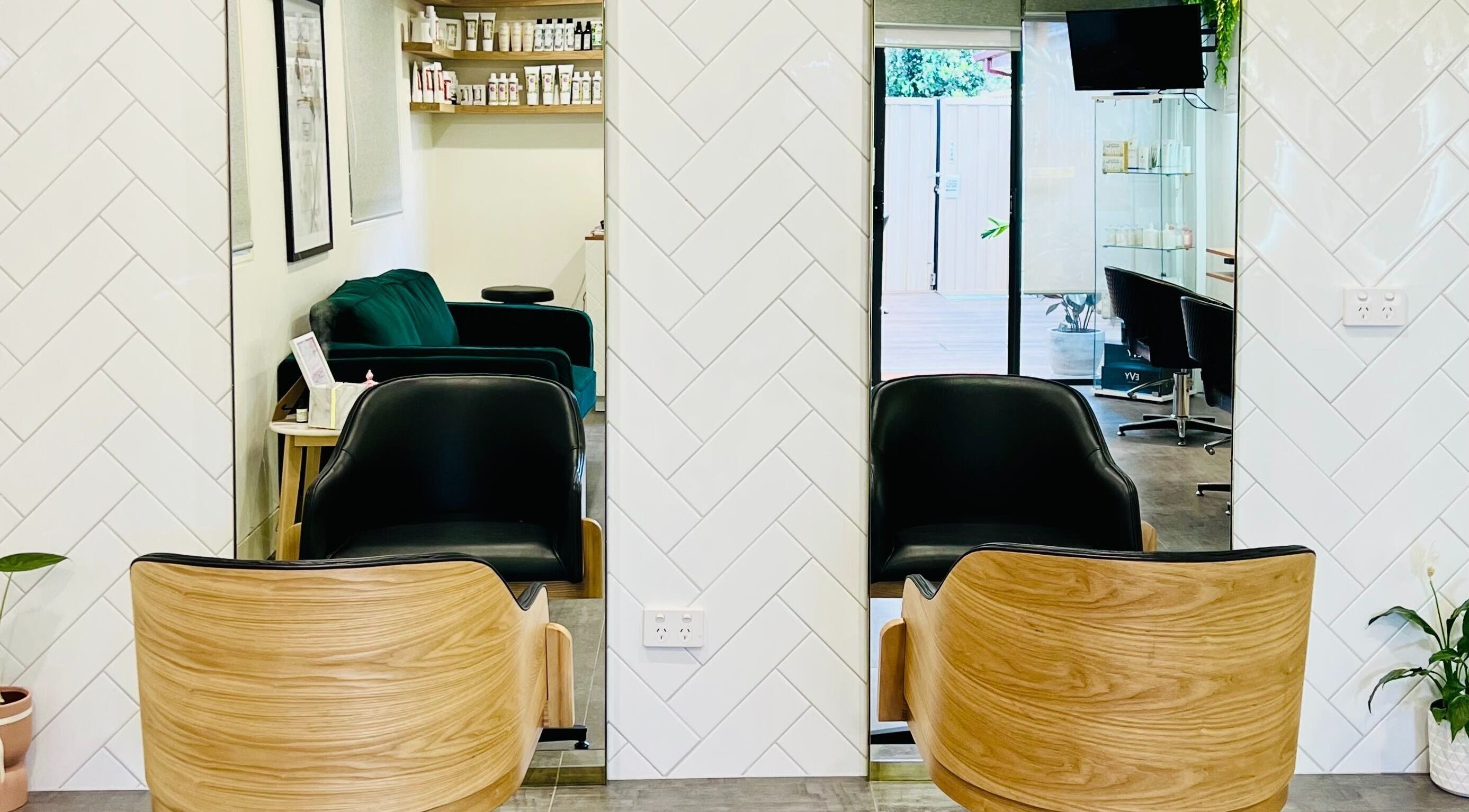 Modern salon chairs and decor at Hairjaz Studio, Melbourne, Victoria, AU showcasing elegance and style.