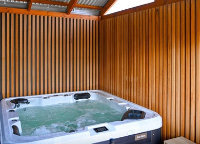 Relaxing hot tub at The Dtox Room, Melbourne, Victoria, AU, offering rejuvenating wellness experience.