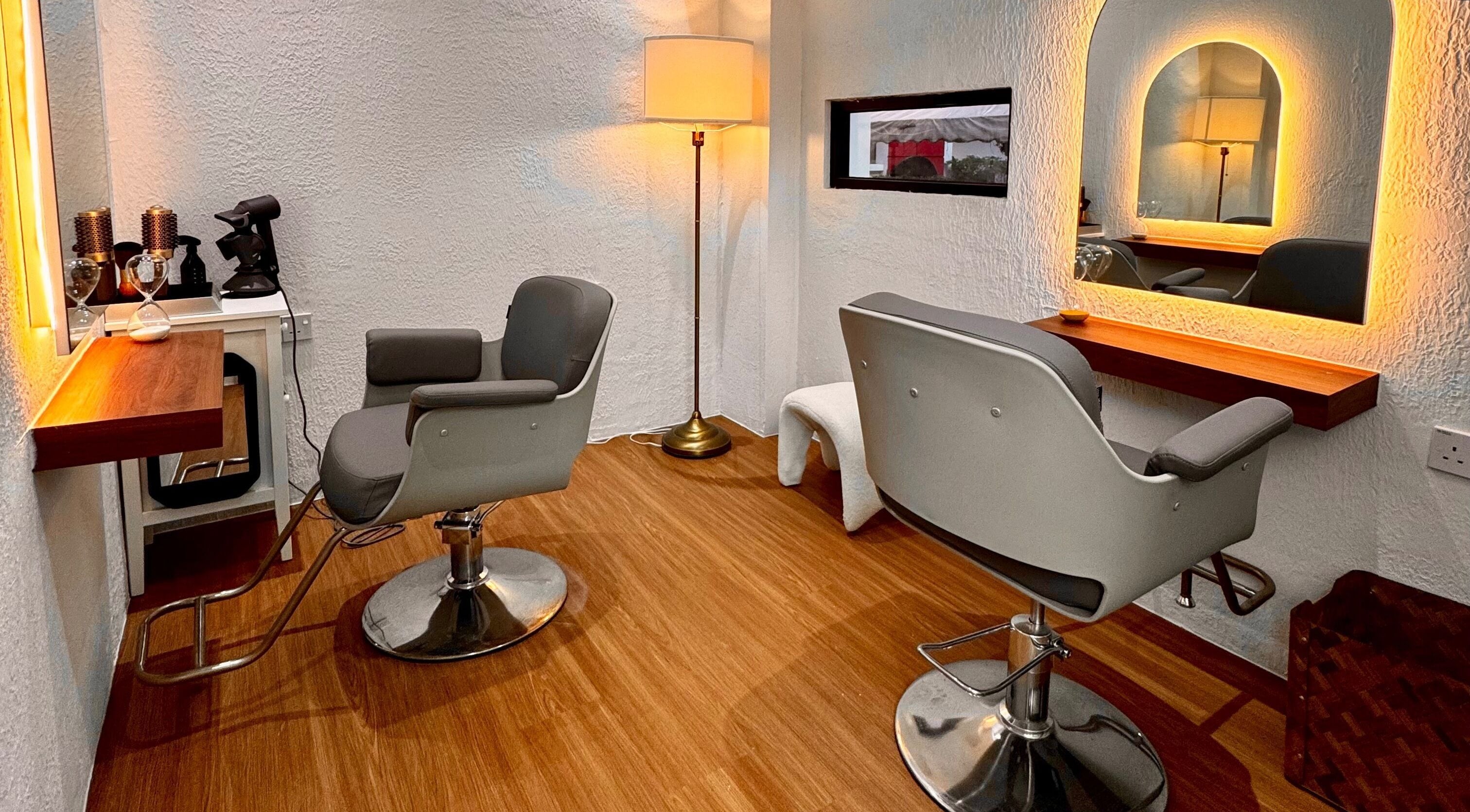 Elegant salon space at Hairkunst Hijabis Luxe, Bandar Baru Bangi, Selangor, MY, featuring modern chairs and warm lighting.