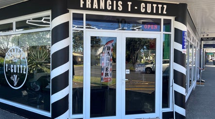 Entrance of Francis T Cuttz, a barber shop in Auckland, Auckland, NZ, with iconic barber pole design.