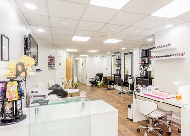 Modern interior of Heavens Salon, London, England, GB with sleek design and nail polish display.