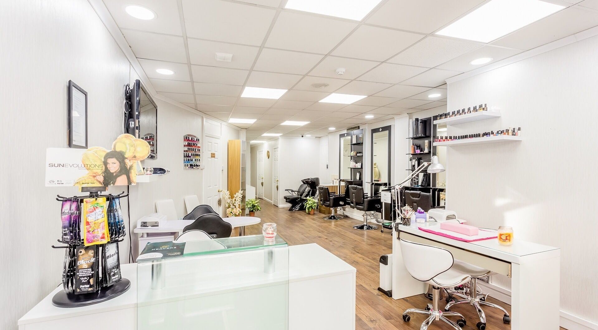 Modern interior of Heavens Salon, London, England, GB with sleek design and nail polish display.