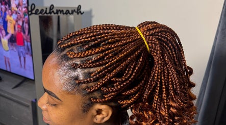 Intricate braided hairstyle at Leeihmarh, Plymouth, England, GB salon, showcasing expert styling.