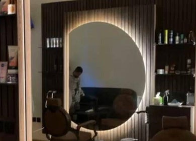 Modern barber chair and products at Razor Origin Barbershop, Buqayq, Eastern Province, SA.