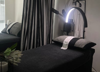 Relaxing spa treatment room at Saseka Co., Pretoria, Gauteng, ZA with a massage bed and ambient lighting.