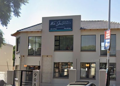 Exterior of Saseka Co. beauty salon in Pretoria, Gauteng, ZA showcasing modern design and large windows.