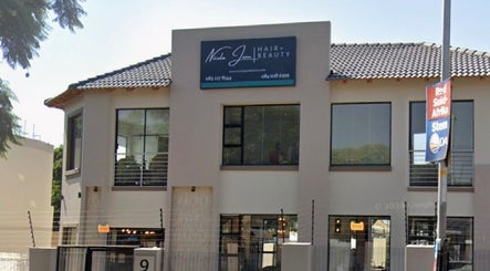 Exterior of Saseka Co. beauty salon in Pretoria, Gauteng, ZA showcasing modern design and large windows.