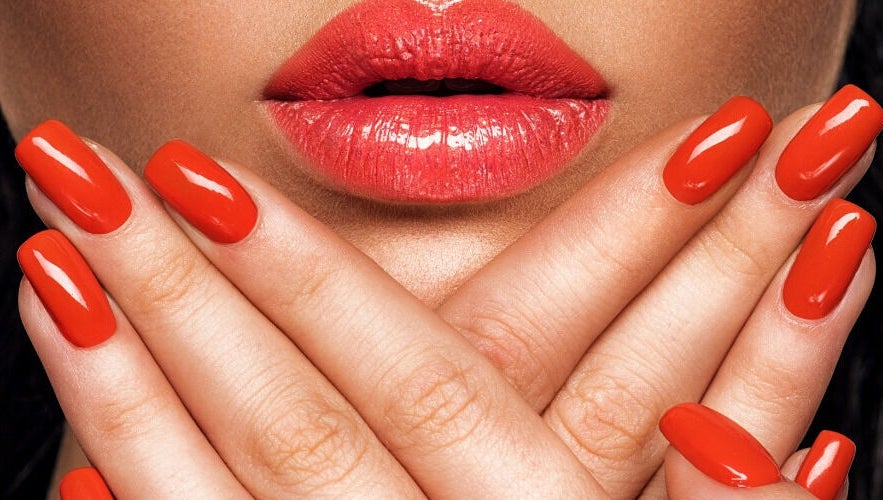 Vibrant orange nails at Real Thai Massage & Nails Stylist in London, England, GB, highlighting beauty services.