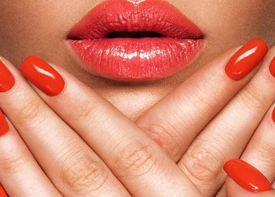 Vibrant orange nails at Real Thai Massage & Nails Stylist in London, England, GB, highlighting beauty services.