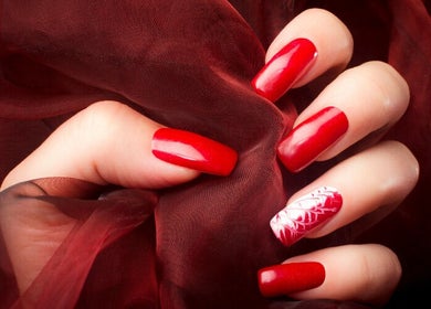 Elegant red manicure by Real Thai Massage & Nails Stylist in London, England, GB.