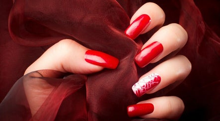 Elegant red manicure by Real Thai Massage & Nails Stylist in London, England, GB.