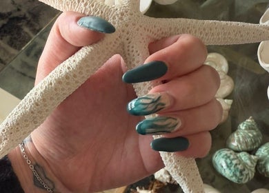 Elegant teal nails with starfish at Enchanted Tips, Kempton Park, Gauteng, ZA, showcasing ocean-inspired designs.