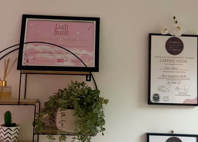 Awards and decor on a wall at Yourluxelounge, Kidderminster, England, GB, showcasing beauty certifications.
