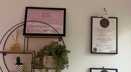 Awards and decor on a wall at Yourluxelounge, Kidderminster, England, GB, showcasing beauty certifications.