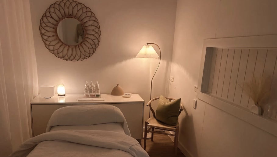 Tranquil treatment room at Calma Studio, Melbourne, Victoria, AU with soft lighting and minimalist decor.