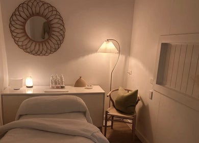 Tranquil treatment room at Calma Studio, Melbourne, Victoria, AU with soft lighting and minimalist decor.