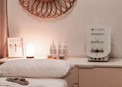 Tranquil treatment room at Calma Studio in Melbourne, Victoria, AU, featuring ambient lighting and spa essentials.
