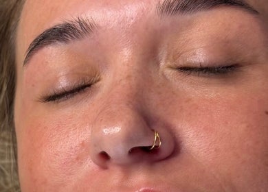 Close-up of peaceful face with closed eyes at Smooth Aesthetics, Glasgow, Scotland, GB.