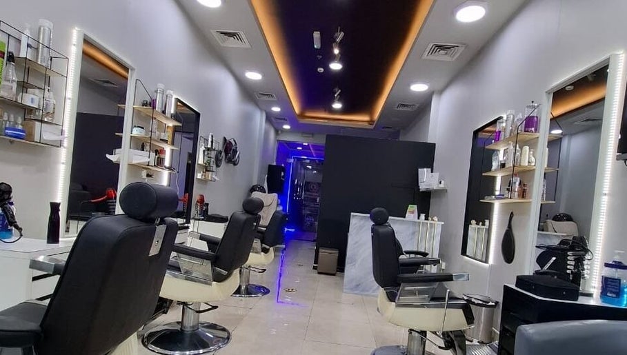 Modern styling chairs and sleek design at Sparkles N Charms Gents Salon, Dubai, AE.