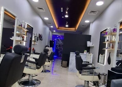 Modern styling chairs and sleek design at Sparkles N Charms Gents Salon, Dubai, AE.