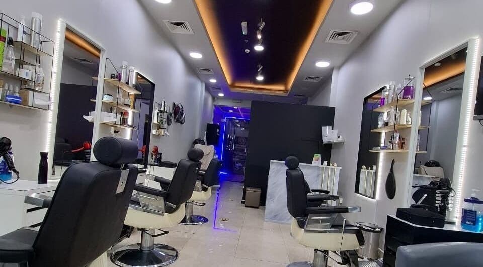 Modern styling chairs and sleek design at Sparkles N Charms Gents Salon, Dubai, AE.