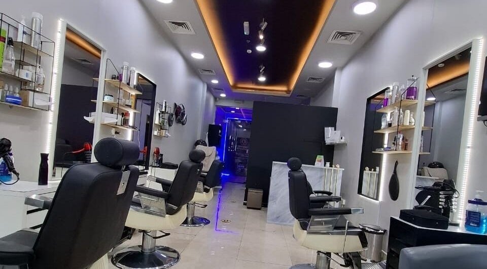 Modern styling chairs and sleek design at Sparkles N Charms Gents Salon, Dubai, AE.